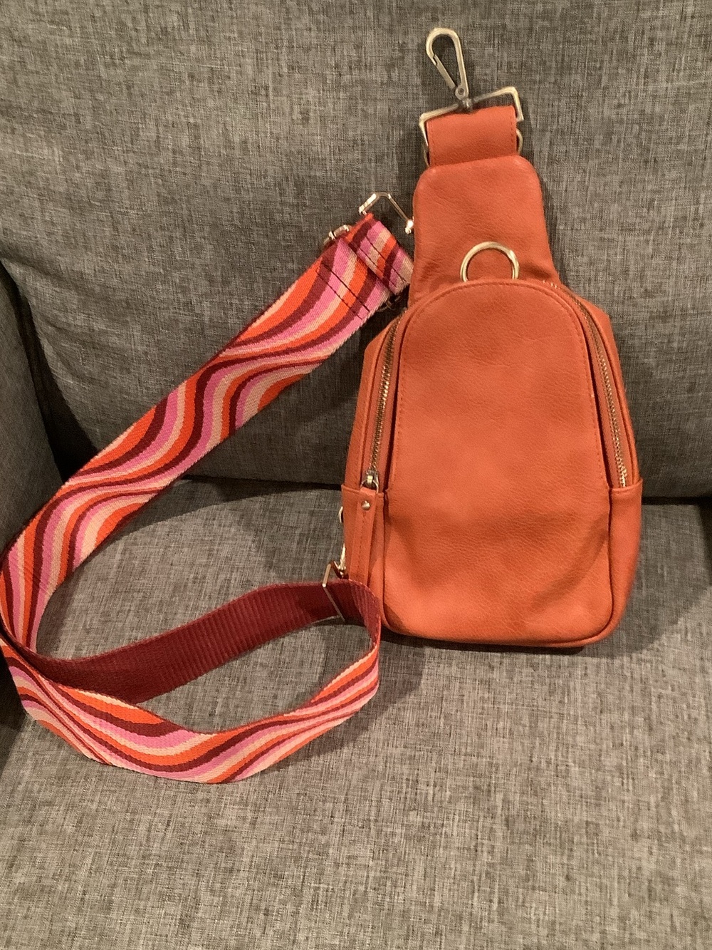 Orange Pebbled Leather Crossbody Sling Bag with Colorful Webbed Strap